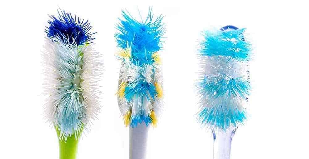 Old toothbrushes with frayed bristles