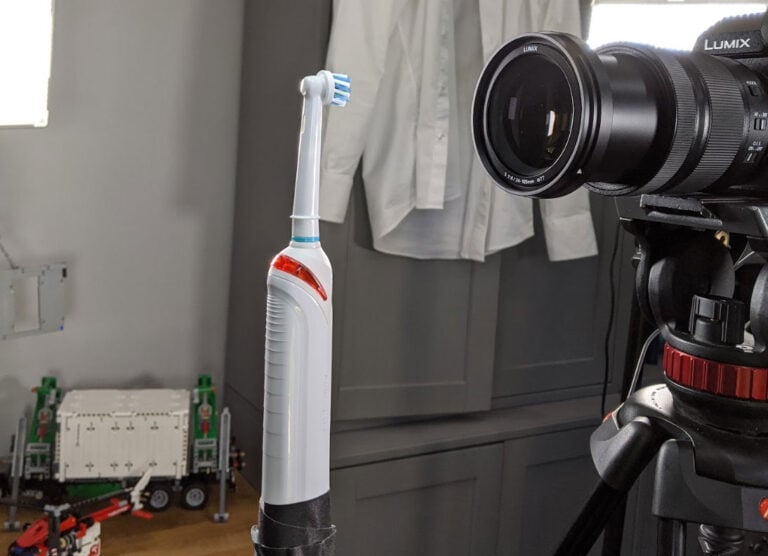An electric toothbrush being tested in front of a camera
