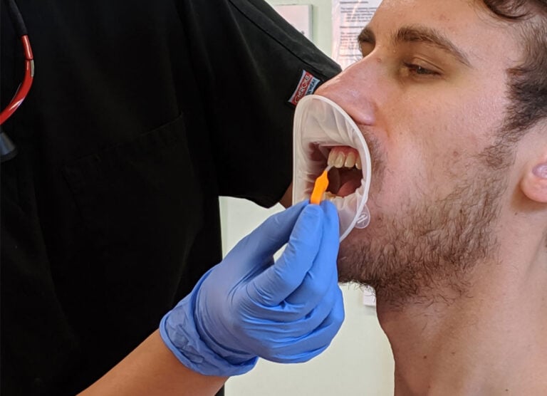 Dentist using interdental on Electric Teeth Co-Founder Chris