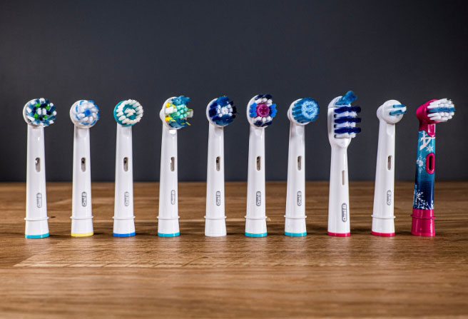 Oral-B replacement heads stood next to each other