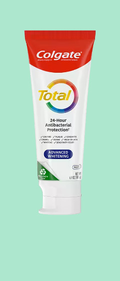 Toothpaste on green background