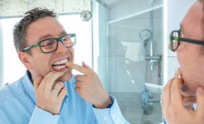 Man inspecting gum