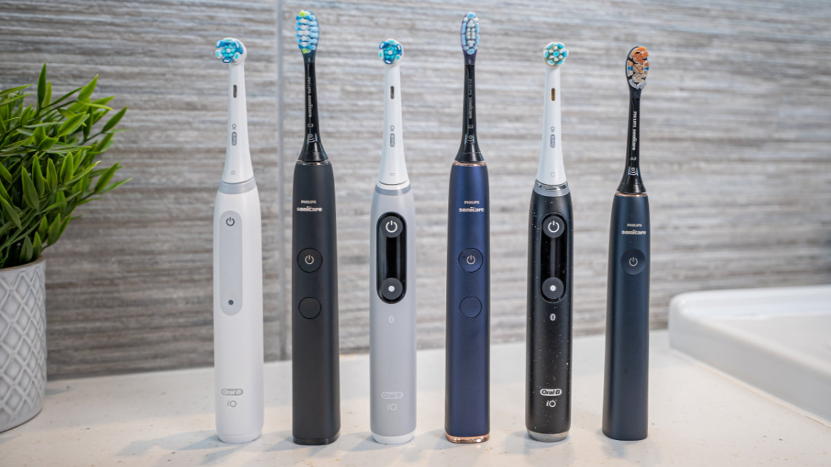 A variety of Sonicare and Oral-B brushes stood next to each other