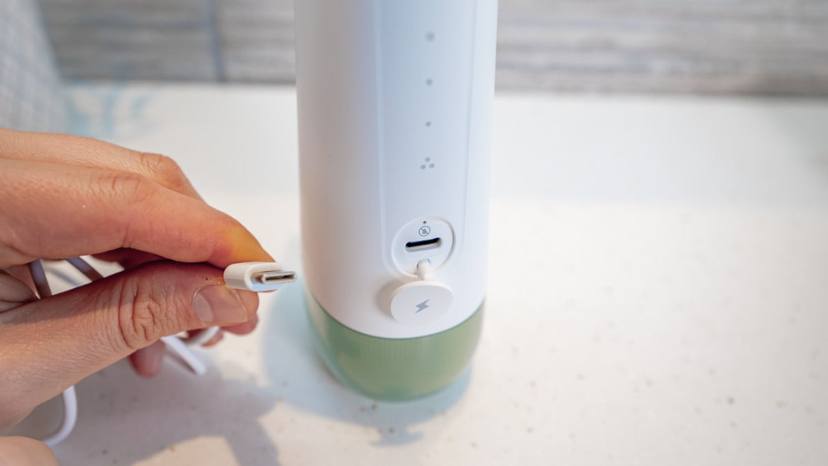 USB-C cable about to be plugged in to Oclean W10 water flosser