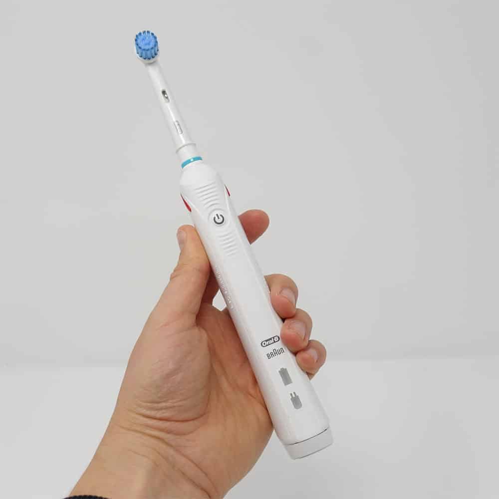 Oral- Kids 6+ toothbrush in adult hand