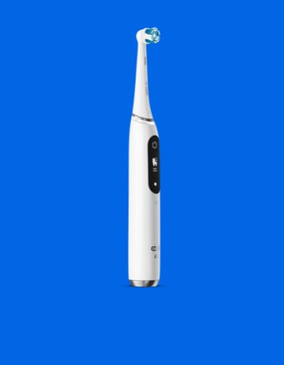 Oral b toothbrush on plain background