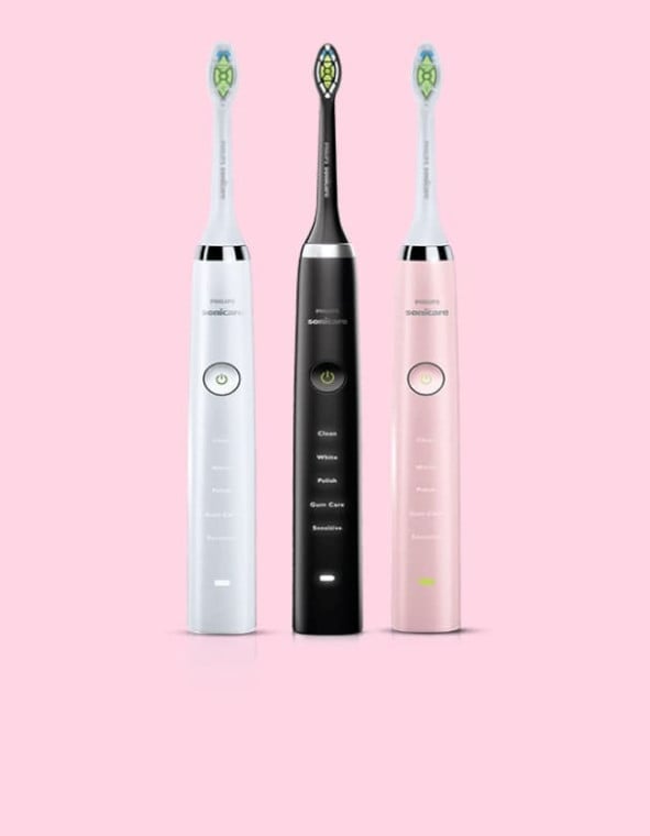Sonicare toothbrushes on pink background