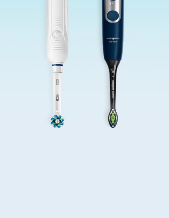 Sonicare toothbrush next to an Oral-B toothbrush