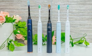 Sonicare toothbrush stood next to each other