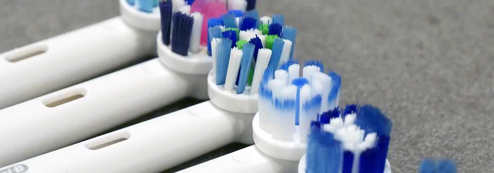 Row of electric toothbrush heads