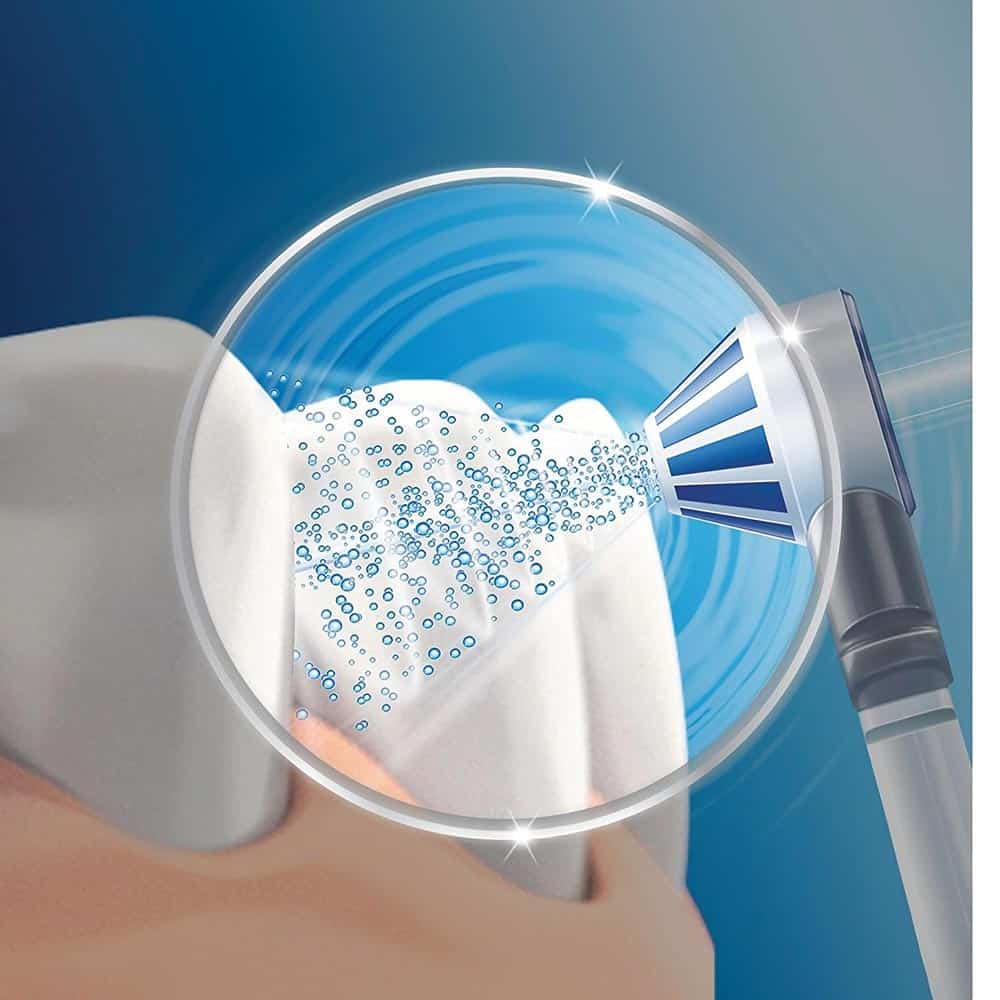 Illustration of Oral-B Oxyjet head cleaning a tooth