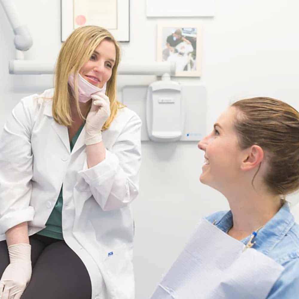 Dentist discussing teeth implants