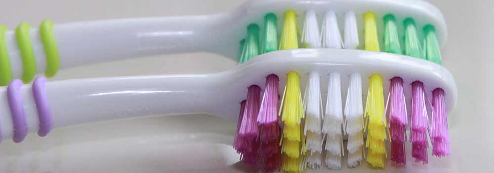 Two manual toothbrushes together