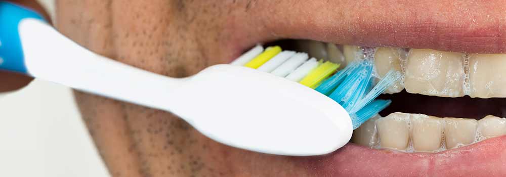 Person brushing teeth