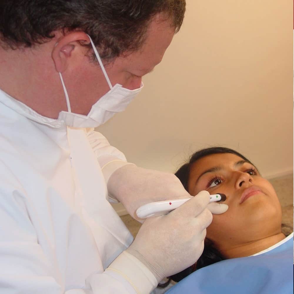 Dentist performing a visual check of a patient during an appointment