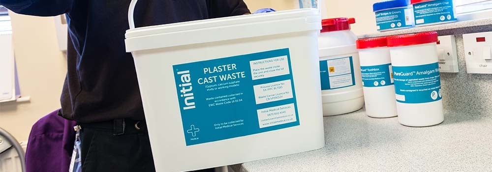 Photo showing tub of plaster cast waste in a dental practice