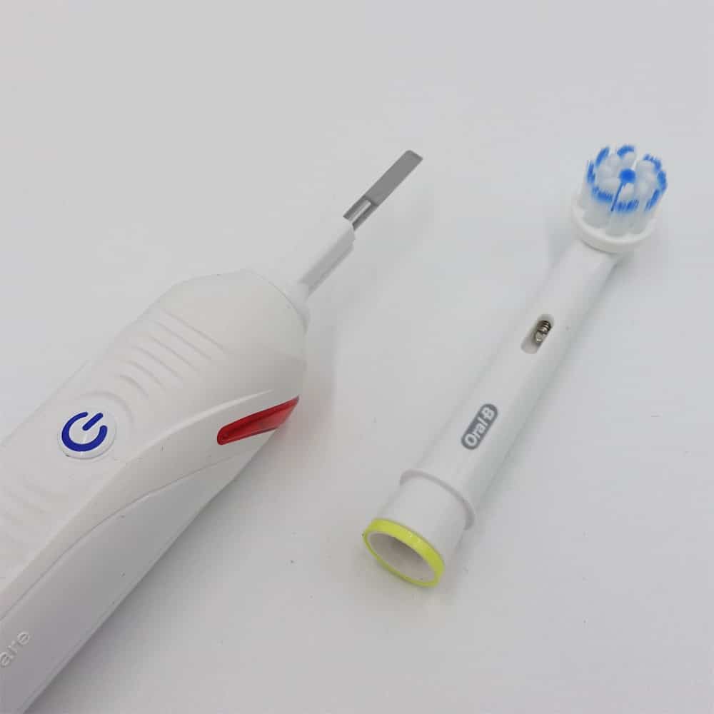 Oral-B Junior Smart with brush head off next to handle