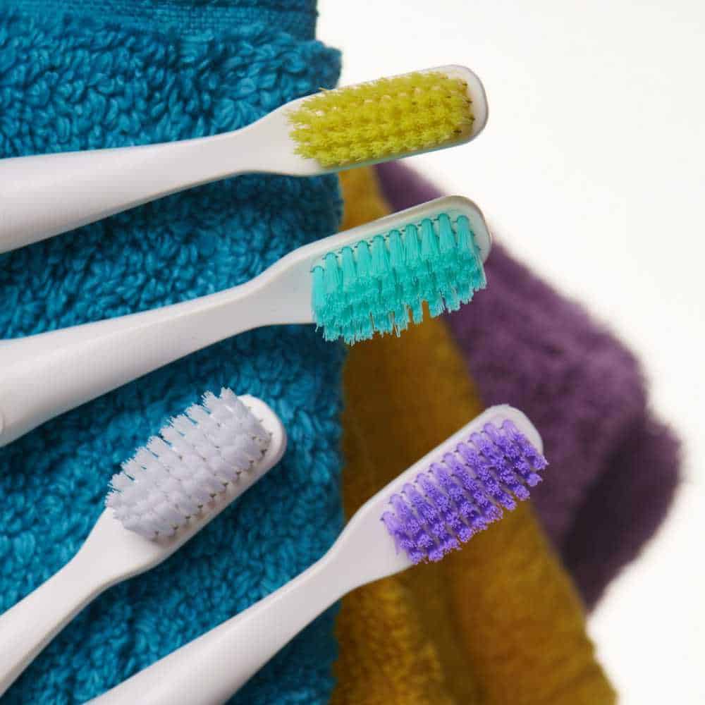 4 reswirl toothbrushes on a towel