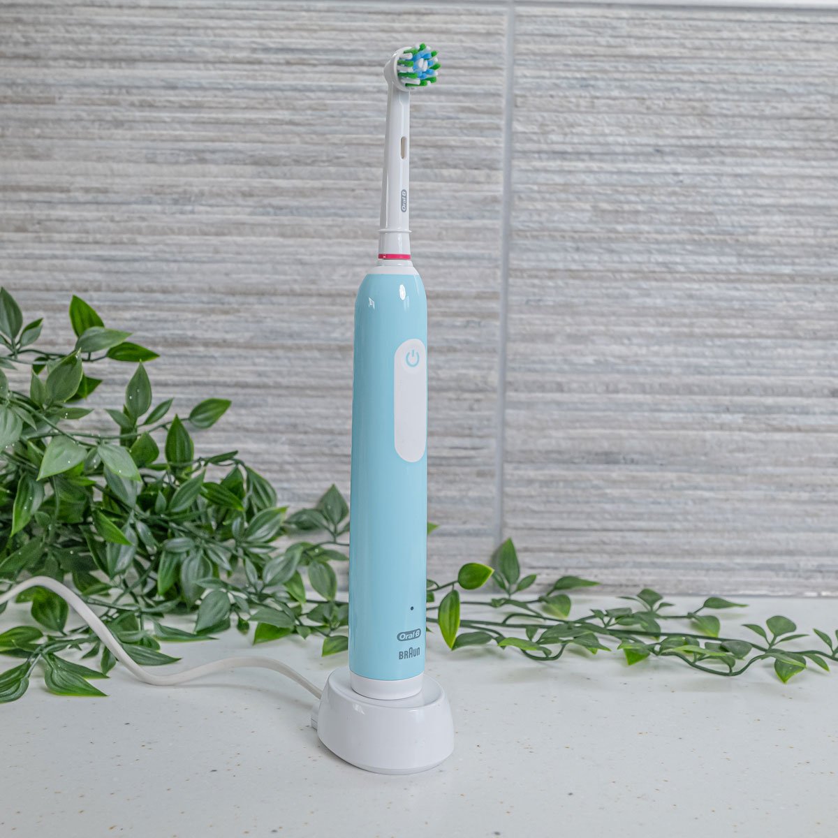 Pro 1 Series electric toothbrush by Oral-B on a charging stand