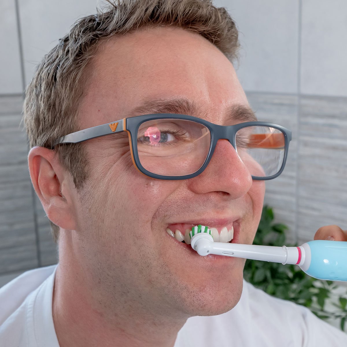 Oral-B Pro 1 electric toothbrush in use in the mouth