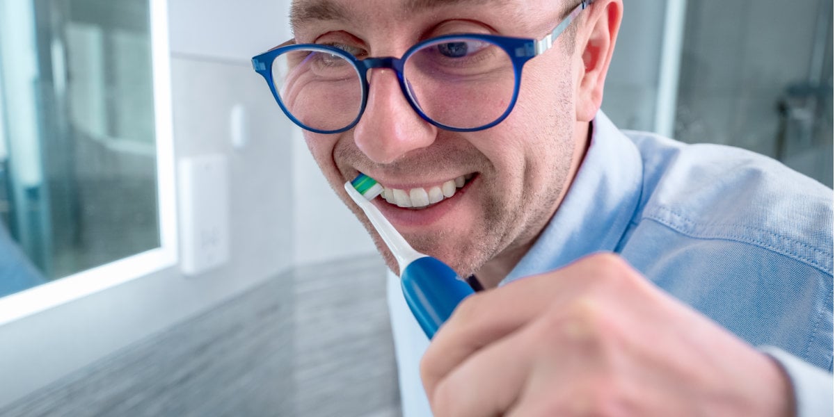 Jon using Sonicare 2100 2026 to clean teeth