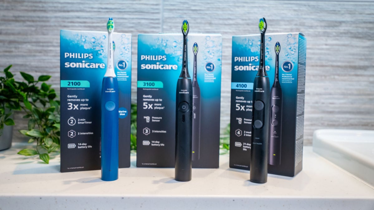 Sonicare 2100 3100 and 4100 2026 editions stood next to each other with boxes