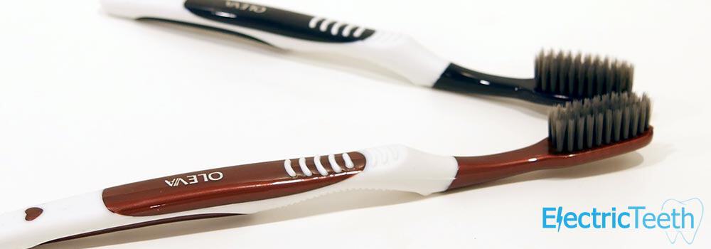 2 toothbrushes with bristles infused with charcoal