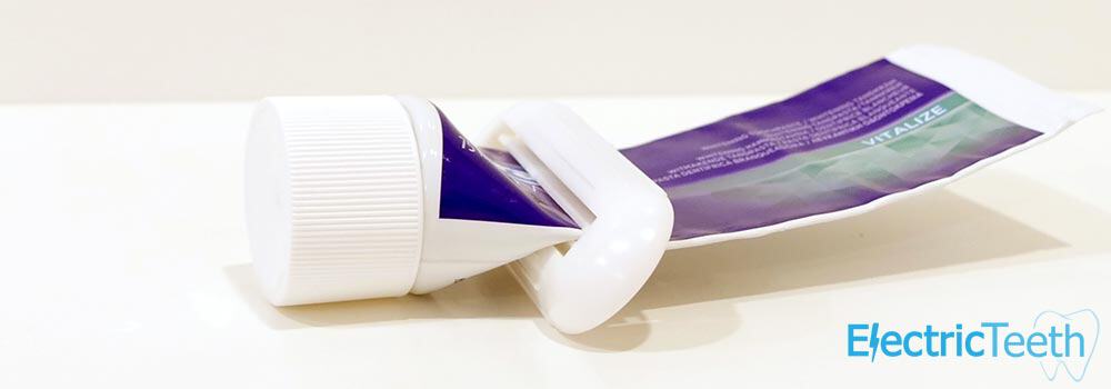 Toothpaste tube in squeezer