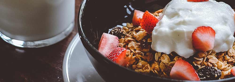 Bowl of granola with strawberries and yoghurt