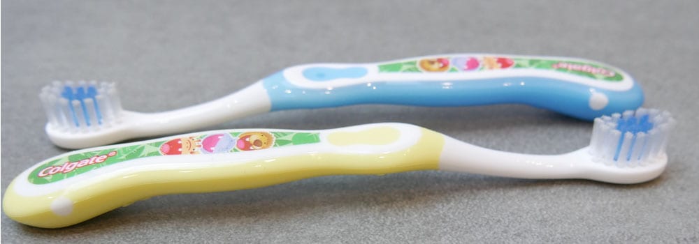Photo of two Colgate My Kids First Toothbrush side by side