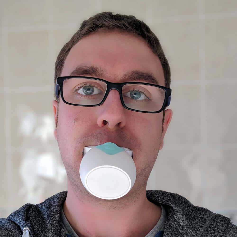 Mouthpiece style toothbrush in use