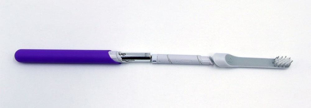 Full width shot showing Quip kids toothbrush detached with battery compartment showing
