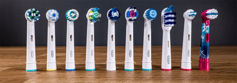 Variety of Oral-B brush heads stood next to each other