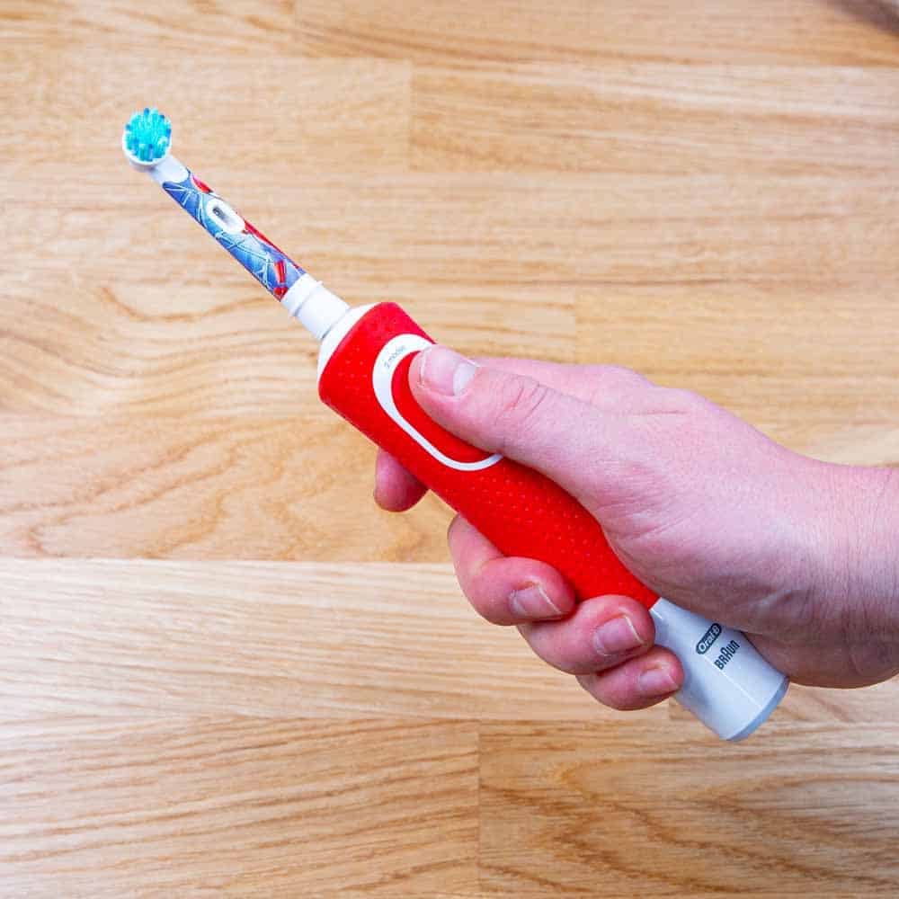 Oral-B Kids toothbrush in hand