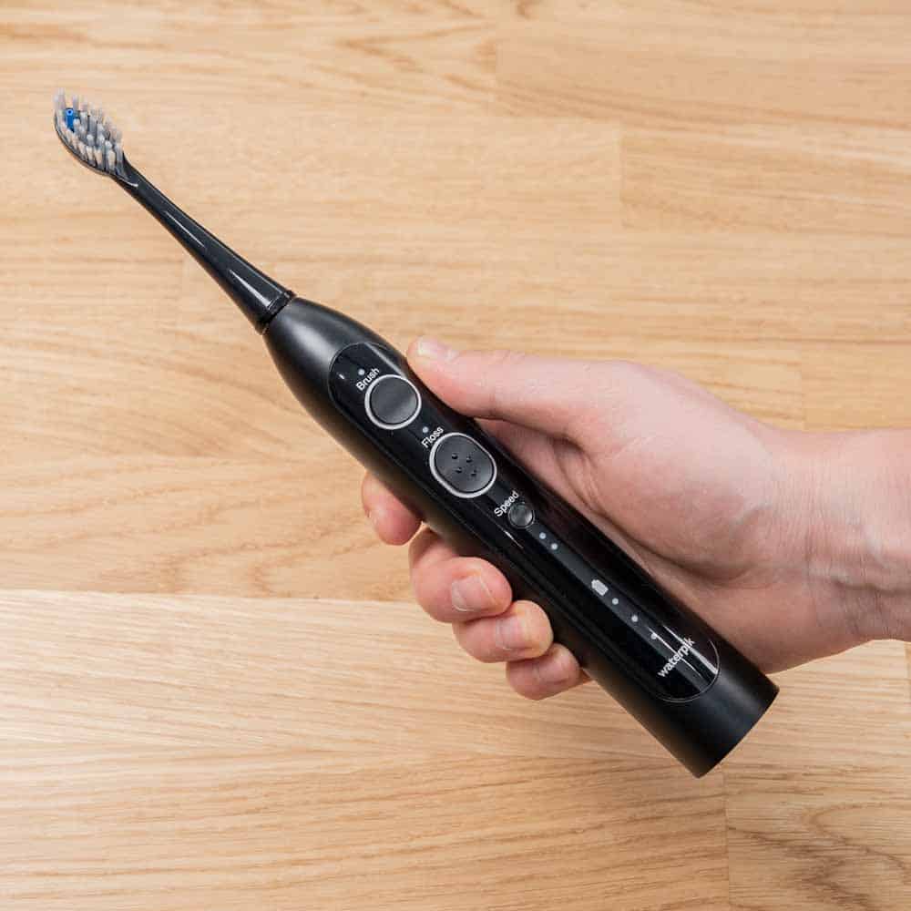 Sonic-Fusion 2.0 toothbrush in hand