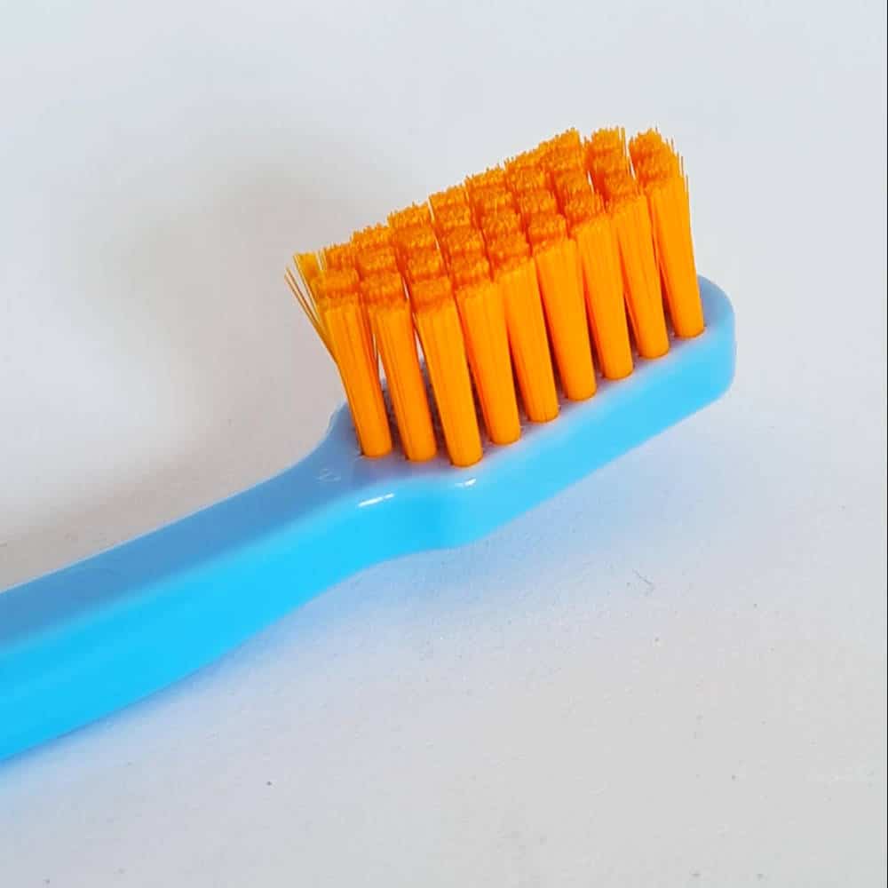 Curaprox brush head - blue handle with orange bristles
