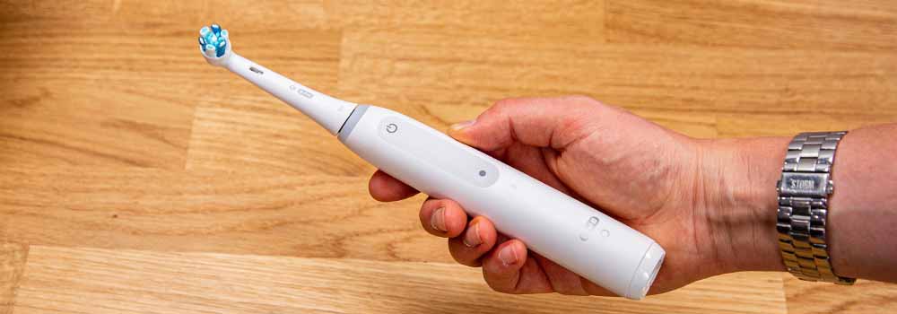 Oral-B iO4 White Electric Toothbrush In Hand