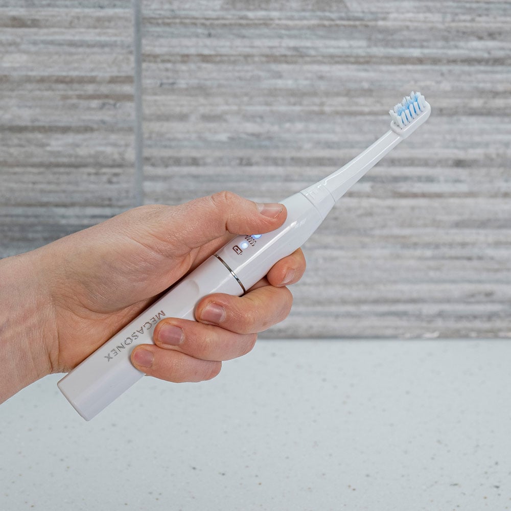 Megsonex ultrasound toothbrush in the hand