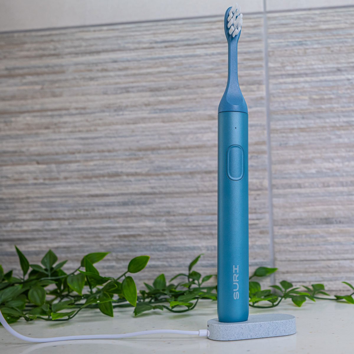 SURI sustainable toothbrush on USB charging stand