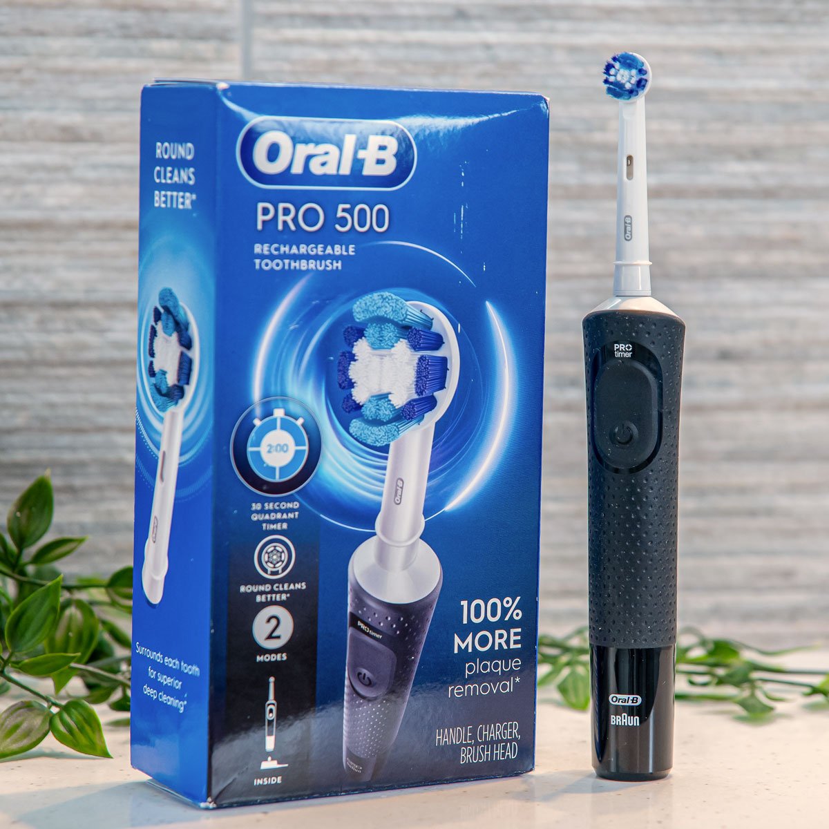 Oral-B Pro 500 electric toothbrush stood next to retail box