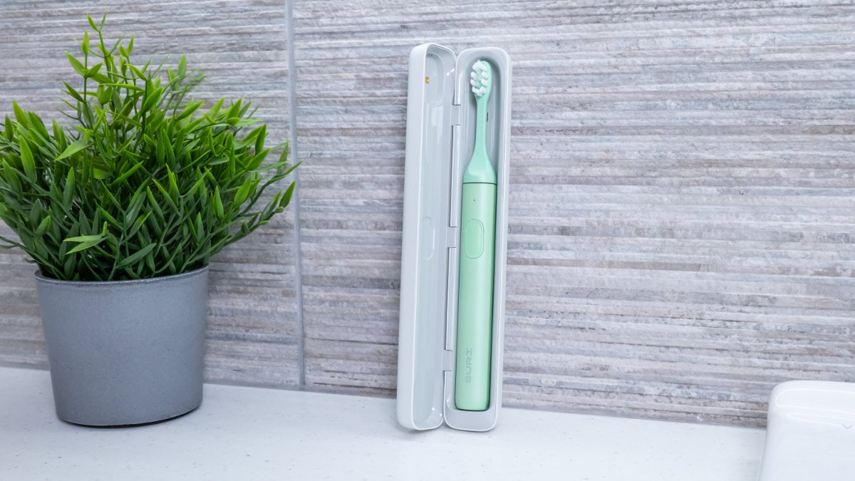 SURI 2.0 in opened charging travel case