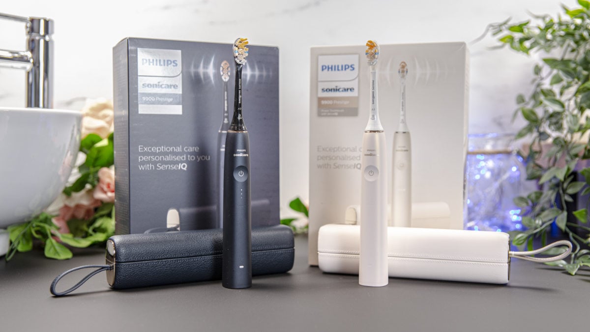 Sonicare Prestige 9900 midnight blue and champagne models stood side by side with travel cases